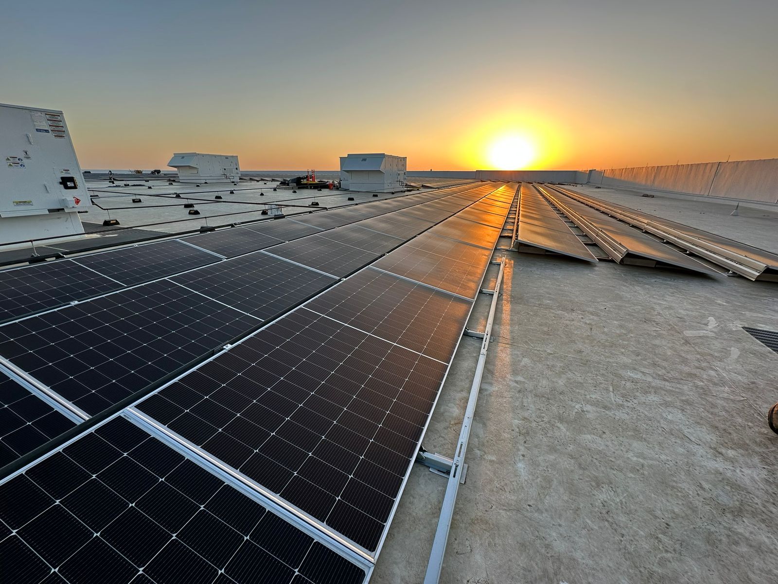 Commercial ballasted system at sunset