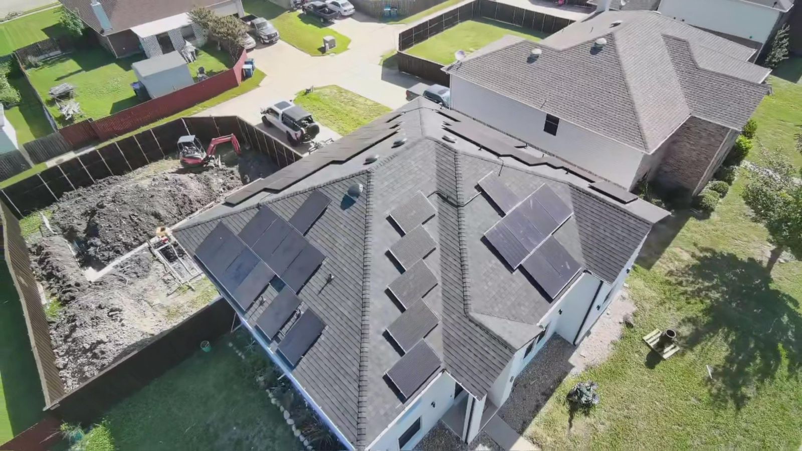 Drone view: arrays staged for a reroof